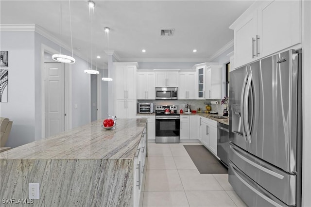 kitchen with visible vents, backsplash, light tile patterned floors, light stone counters, and appliances with stainless steel finishes