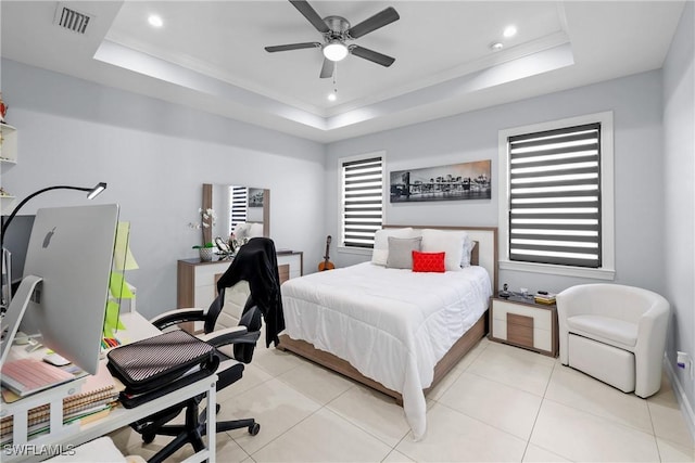 bedroom with visible vents, light tile patterned flooring, recessed lighting, ornamental molding, and a raised ceiling