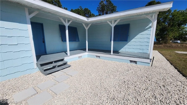 exterior space with crawl space and a porch