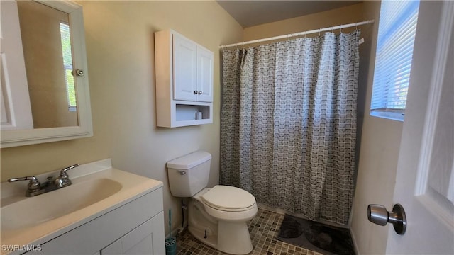 bathroom featuring tile patterned flooring, toilet, vanity, and a shower with curtain