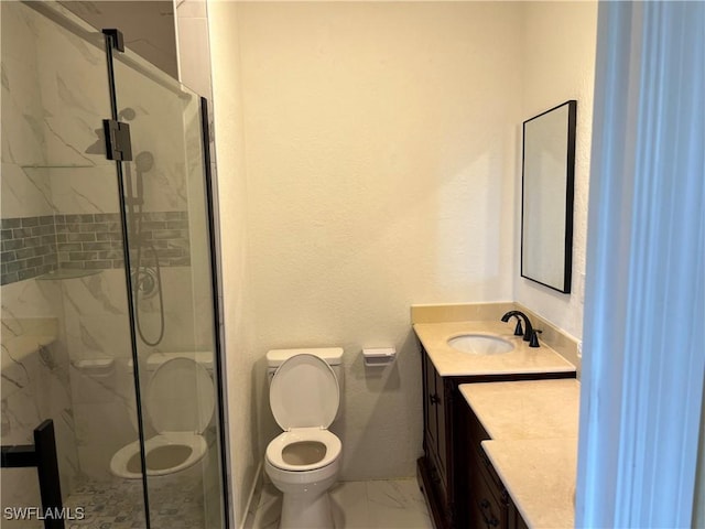 2609 4th St SW, Lehigh Acres, FL 33976 - bathroom with a marble finish shower, toilet, marble finish floor, and vanity