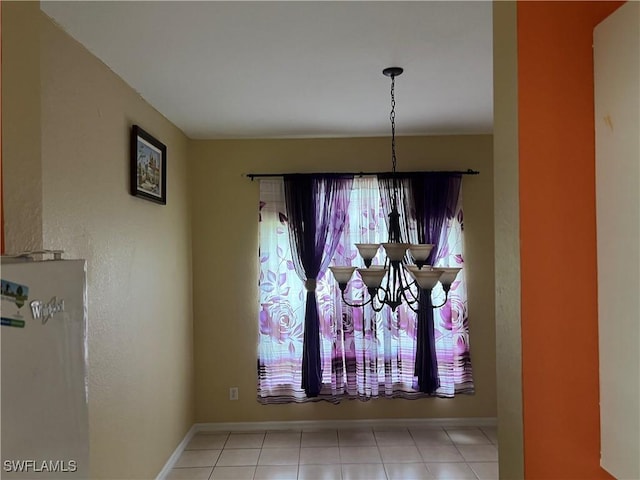 2609 4th St SW, Lehigh Acres, FL 33976 - details featuring baseboards and a chandelier