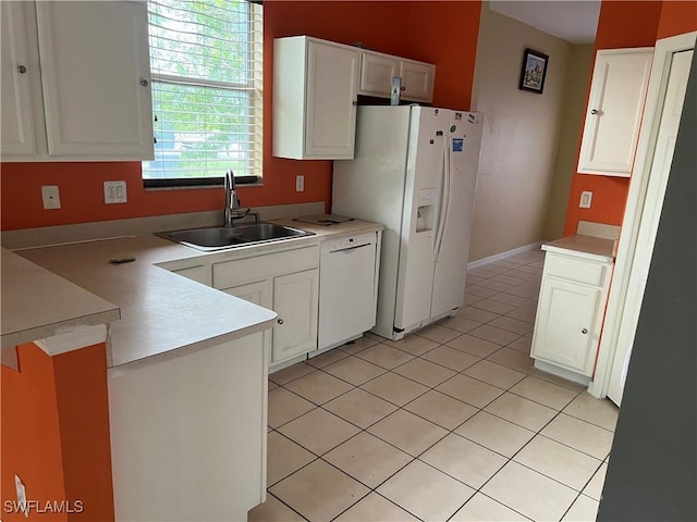 2609 4th St SW, Lehigh Acres, FL 33976 - kitchen with a sink, white appliances, a peninsula, and white cabinets