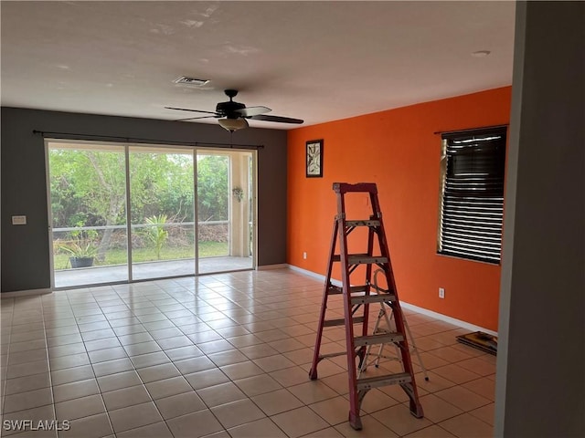 2609 4th St SW, Lehigh Acres, FL 33976 - unfurnished room with visible vents, baseboards, a ceiling fan, and tile patterned flooring