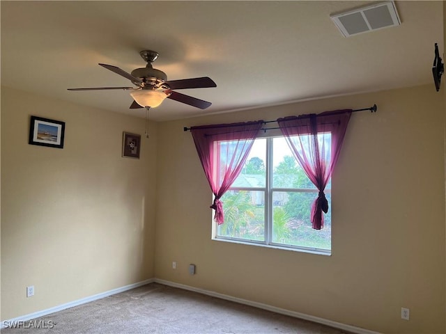 2609 4th St SW, Lehigh Acres, FL 33976 - spare room featuring visible vents, baseboards, ceiling fan, and carpet floors
