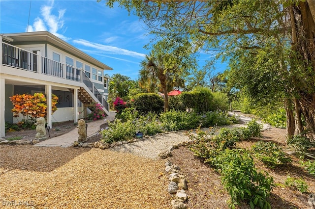 view of yard featuring stairs