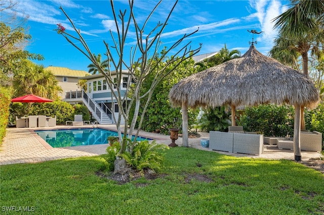outdoor pool featuring stairs, a gazebo, an outdoor living space, a lawn, and a patio area