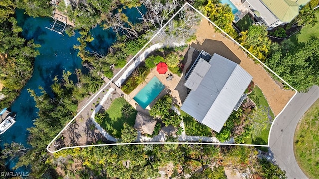 birds eye view of property featuring a water view