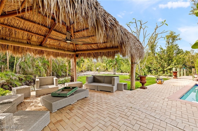 view of patio with outdoor lounge area, a gazebo, and an outdoor pool