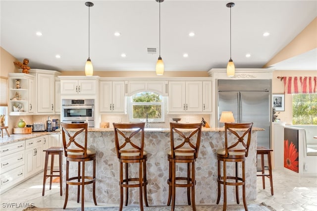 kitchen featuring decorative backsplash, a healthy amount of sunlight, stainless steel appliances, and open shelves