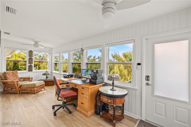 sunroom with visible vents and wood finished floors