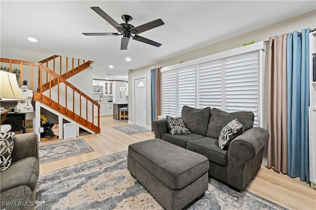 living room with stairs, recessed lighting, wood finished floors, and ceiling fan