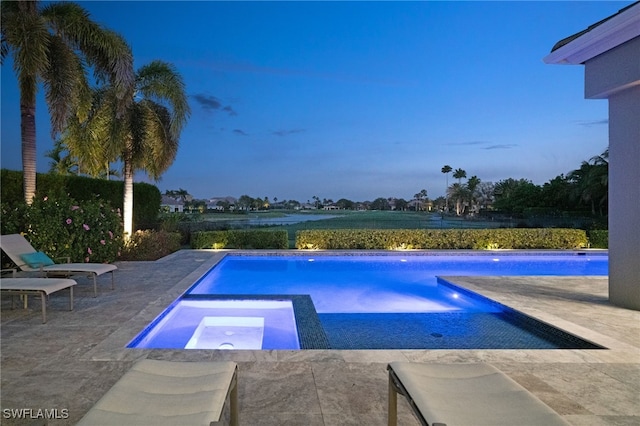 view of pool featuring a patio area and a pool with connected hot tub