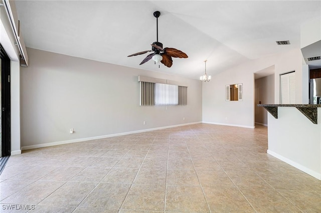 26955 Croise Dr, Bonita Springs, FL 34135 - empty room featuring baseboards, vaulted ceiling, light tile patterned floors, visible vents, and ceiling fan with notable chandelier