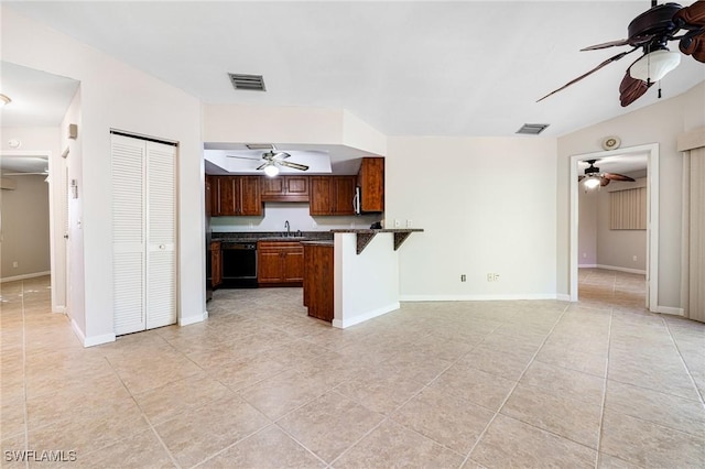 26955 Croise Dr, Bonita Springs, FL 34135 - kitchen featuring visible vents, ceiling fan, and dark countertops