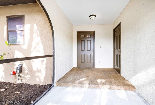 26955 Croise Dr, Bonita Springs, FL 34135 - doorway to property with stucco siding