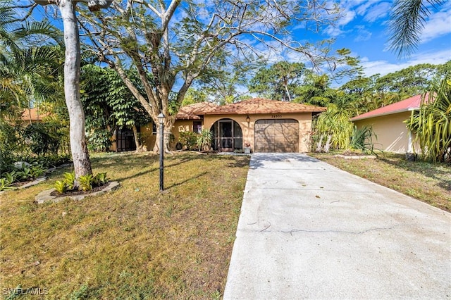 26955 Croise Dr, Bonita Springs, FL 34135 - view of front of house featuring a garage, a front yard, concrete driveway, and stucco siding