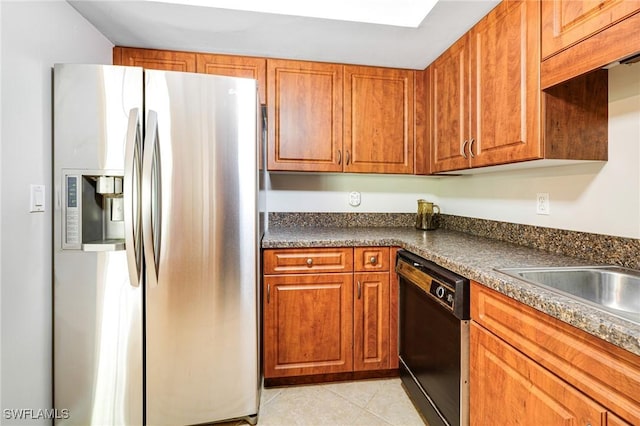 26955 Croise Dr, Bonita Springs, FL 34135 - kitchen featuring stainless steel refrigerator with ice dispenser, light tile patterned flooring, dishwasher, dark countertops, and brown cabinets