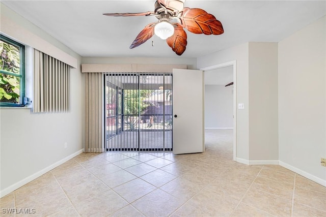 26955 Croise Dr, Bonita Springs, FL 34135 - tiled spare room featuring baseboards and a ceiling fan