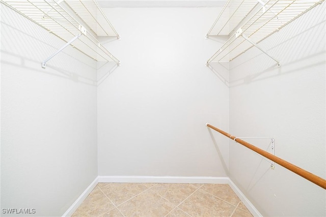 26955 Croise Dr, Bonita Springs, FL 34135 - walk in closet featuring light tile patterned flooring