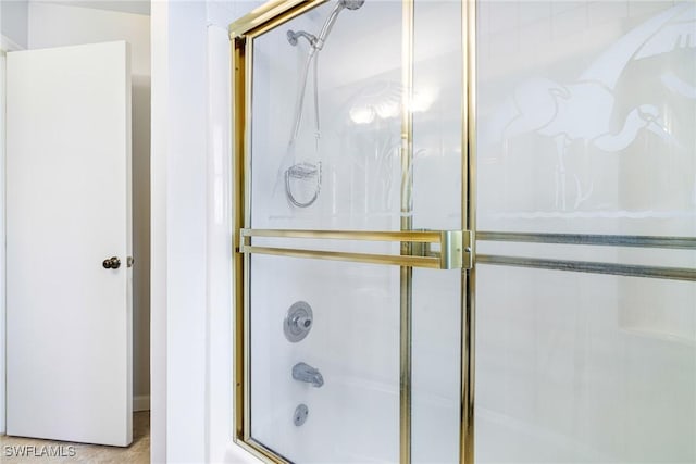 26955 Croise Dr, Bonita Springs, FL 34135 - bathroom featuring shower / bath combination with glass door