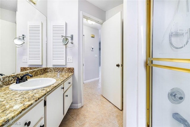 26955 Croise Dr, Bonita Springs, FL 34135 - bathroom featuring vanity, baseboards, and tile patterned flooring