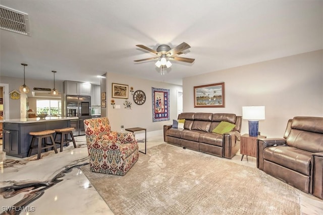 2215 Club House Rd, North Fort Myers, FL 33917 - living room featuring visible vents and a ceiling fan