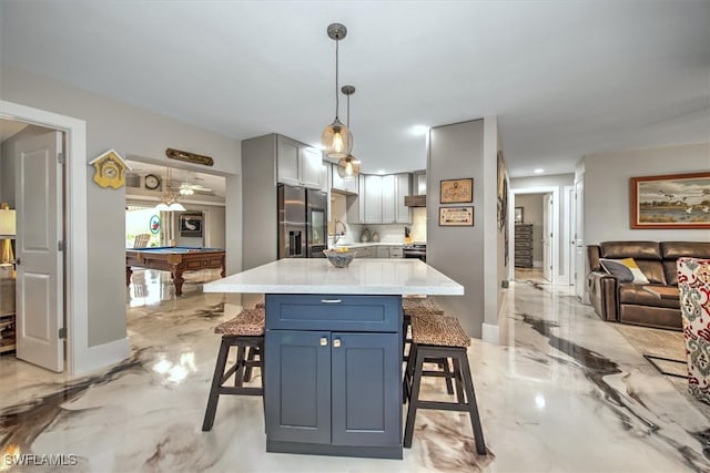 2215 Club House Rd, North Fort Myers, FL 33917 - kitchen with billiards, marble finish floor, a breakfast bar area, and stainless steel refrigerator with ice dispenser