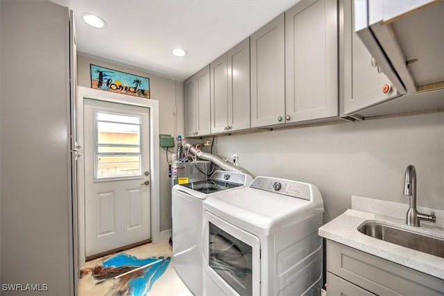2215 Club House Rd, North Fort Myers, FL 33917 - laundry room featuring a sink, electric water heater, washing machine and dryer, recessed lighting, and cabinet space