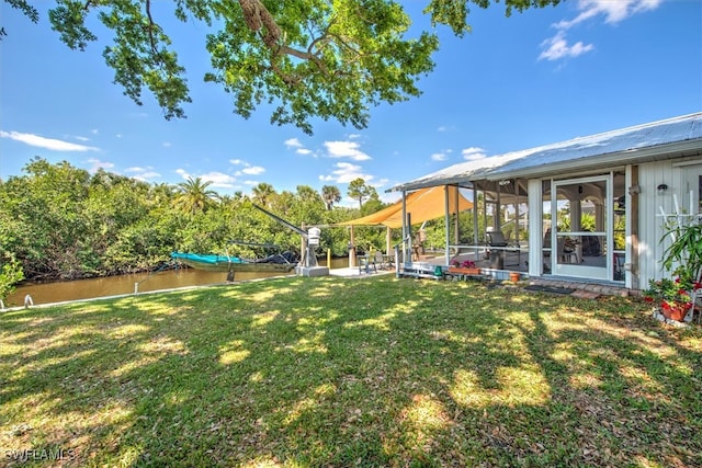 2215 Club House Rd, North Fort Myers, FL 33917 - view of yard with a water view and a sunroom