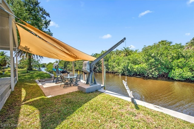 2215 Club House Rd, North Fort Myers, FL 33917 - view of dock featuring a patio, a lawn, and a water view
