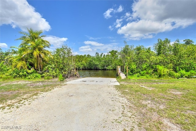 2215 Club House Rd, North Fort Myers, FL 33917 - view of road featuring a forest view and a water view