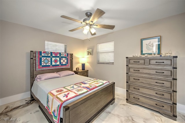 2215 Club House Rd, North Fort Myers, FL 33917 - bedroom with multiple windows, marble finish floor, baseboards, and ceiling fan