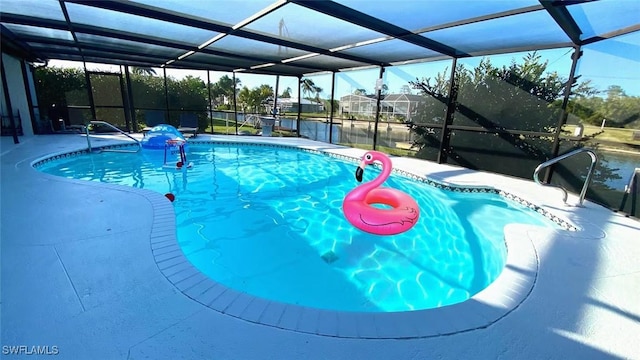 outdoor pool featuring a lanai and a patio area