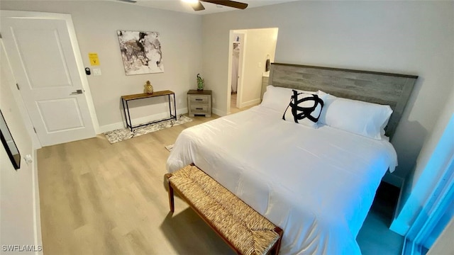 bedroom with light wood-type flooring, baseboards, and ceiling fan