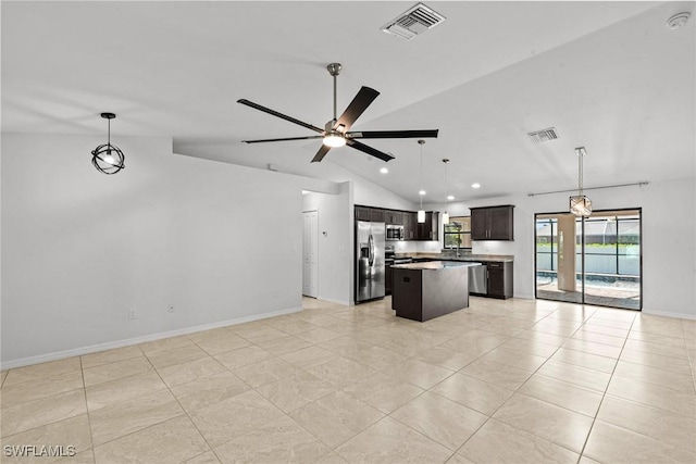 3734 SE 3rd Pl, Cape Coral, FL 33904 - kitchen featuring visible vents, a kitchen island, vaulted ceiling, stainless steel appliances, and open floor plan