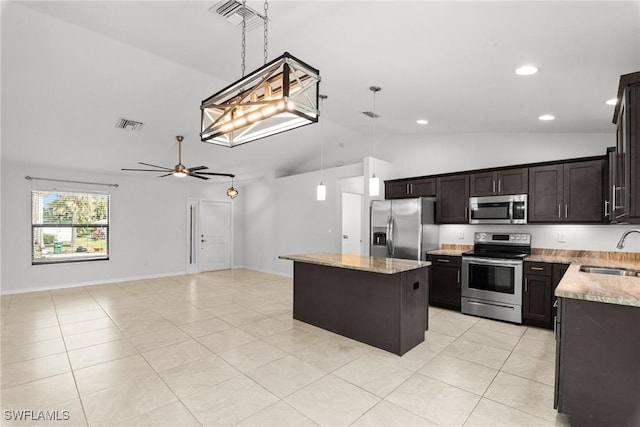3734 SE 3rd Pl, Cape Coral, FL 33904 - kitchen featuring visible vents, a kitchen island, appliances with stainless steel finishes, a sink, and hanging light fixtures