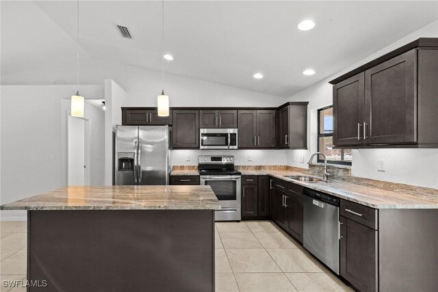 3734 SE 3rd Pl, Cape Coral, FL 33904 - kitchen featuring light tile patterned floors, dark brown cabinets, vaulted ceiling, a sink, and stainless steel appliances