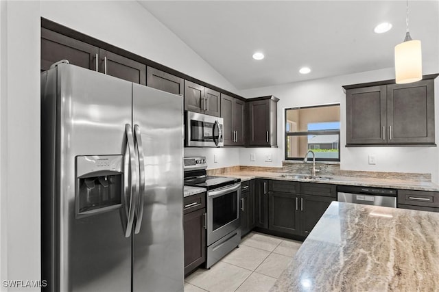 3734 SE 3rd Pl, Cape Coral, FL 33904 - kitchen featuring light tile patterned floors, light stone countertops, vaulted ceiling, a sink, and stainless steel appliances