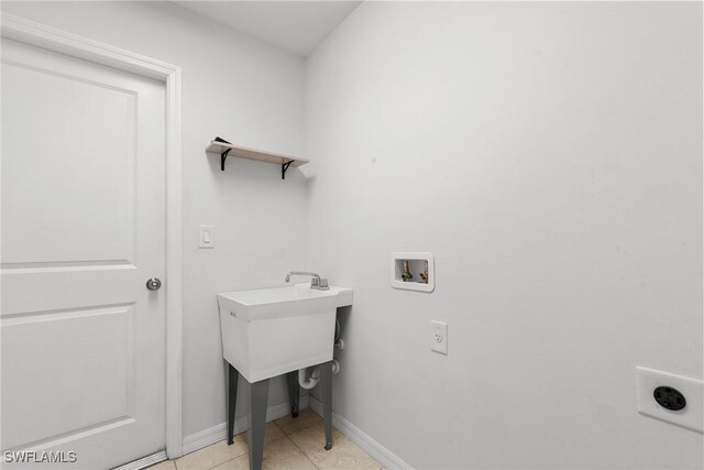 3734 SE 3rd Pl, Cape Coral, FL 33904 - laundry area featuring electric dryer hookup, baseboards, light tile patterned floors, laundry area, and hookup for a washing machine