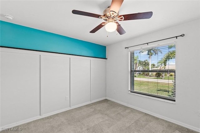 3734 SE 3rd Pl, Cape Coral, FL 33904 - spare room featuring light colored carpet, baseboards, and a ceiling fan