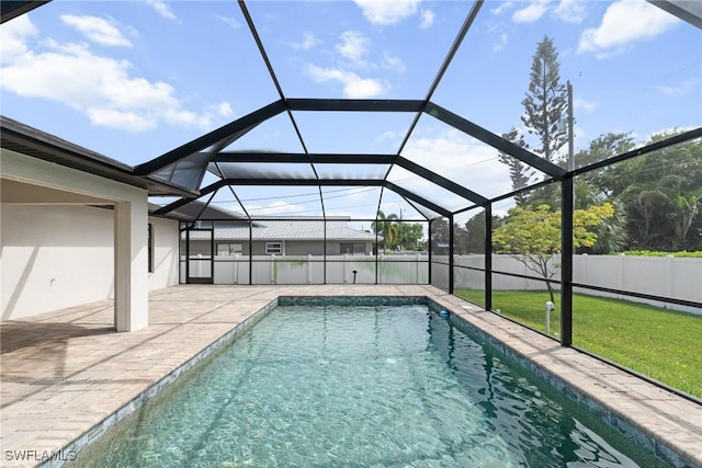 3734 SE 3rd Pl, Cape Coral, FL 33904 - view of pool with a yard, glass enclosure, a patio, fence, and a fenced in pool