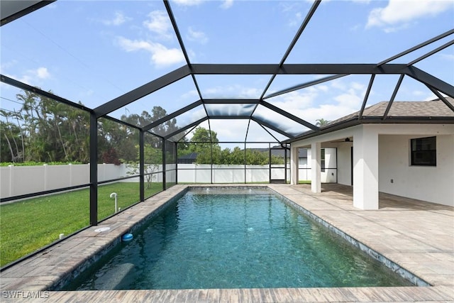 3734 SE 3rd Pl, Cape Coral, FL 33904 - view of swimming pool with a patio area, a lawn, a fenced backyard, a fenced in pool, and a lanai