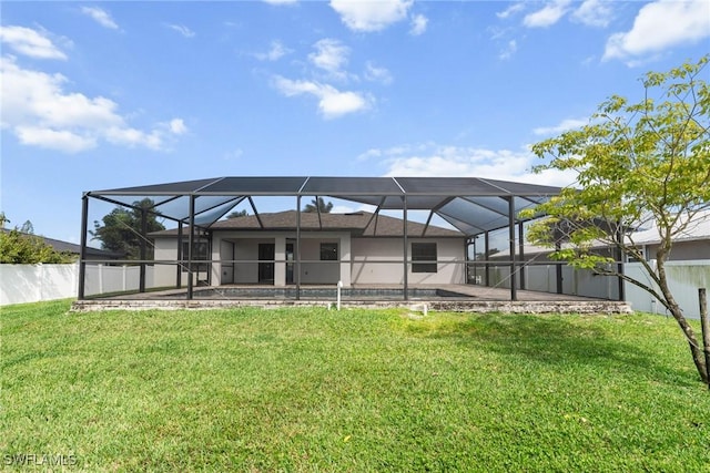 3734 SE 3rd Pl, Cape Coral, FL 33904 - rear view of house featuring fence, a patio, a lawn, and glass enclosure