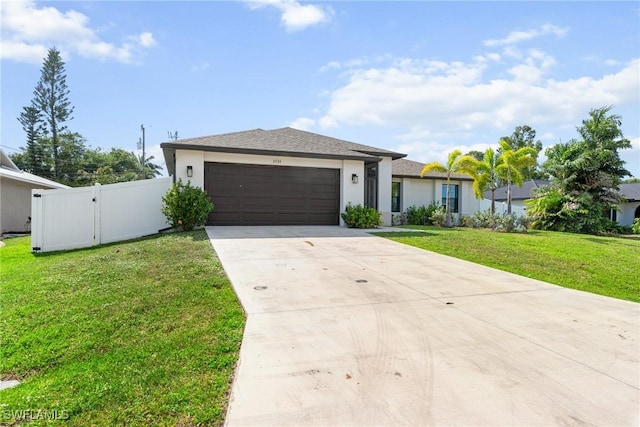 3734 SE 3rd Pl, Cape Coral, FL 33904 - view of front facade with a garage, a front yard, concrete driveway, and a gate