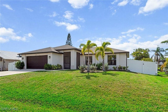 3734 SE 3rd Pl, Cape Coral, FL 33904 - view of front of house with a front lawn, stucco siding, a garage, and concrete driveway