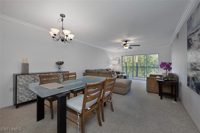 dining area featuring baseboards, light carpet, crown molding, and ceiling fan with notable chandelier