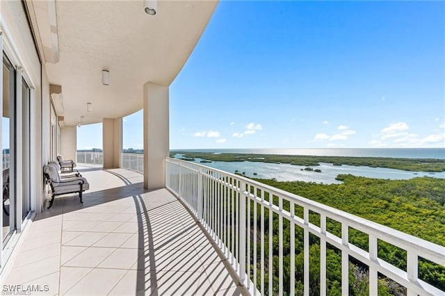 balcony featuring a water view