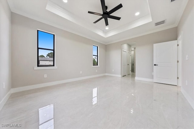unfurnished bedroom featuring visible vents, marble finish floor, a raised ceiling, and baseboards
