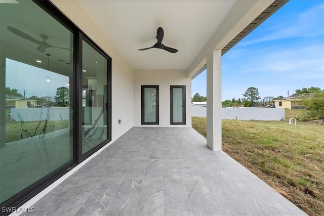 view of patio featuring a ceiling fan